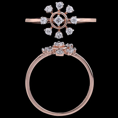 Rose gold ring featuring a central round diamond encircled by eight smaller diamonds arranged in a symmetrical floral or starburst pattern, shown in both top and side views against a black background.
