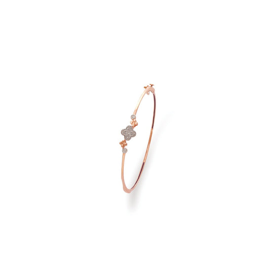 A minimal yet striking rose gold bracelet by jnjbymadhuri, featuring a modern geometric design accented with diamond-like embellishments—perfect for a refined, everyday elegance.
