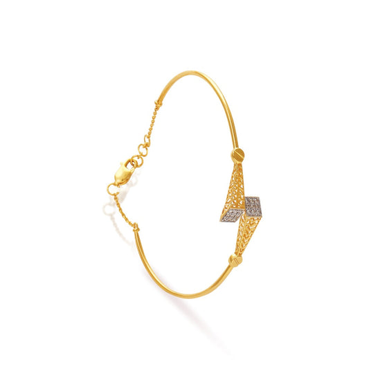 Elegant gold bracelet by jnjbymadhuri featuring a unique V-shaped centerpiece encrusted with diamonds, complemented by delicate chain detailing and a secure clasp for a refined and modern look.
