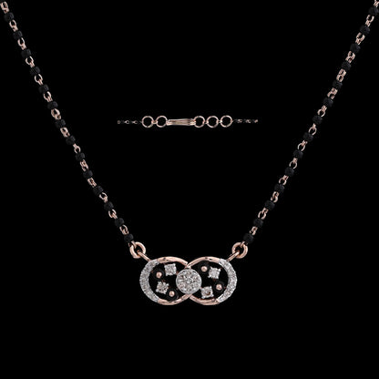 Elegant mangalsutra by jnjbymadhuri featuring an infinity symbol pendant embellished with square and round stones, attached to a traditional black beaded chain with adjustable clasp links.
