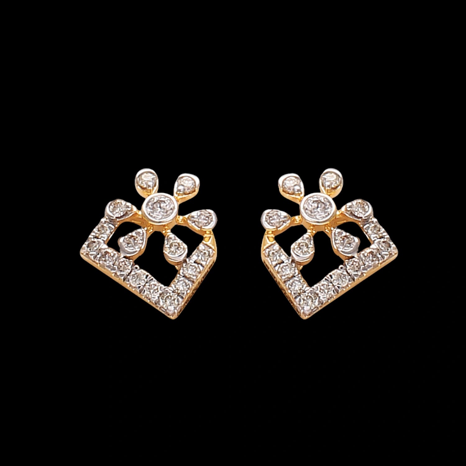 "Pair of contemporary gold earrings with diamond accents arranged in a rectangular and floral-dot pattern, displayed on a black background by jnjbymadhuri."

