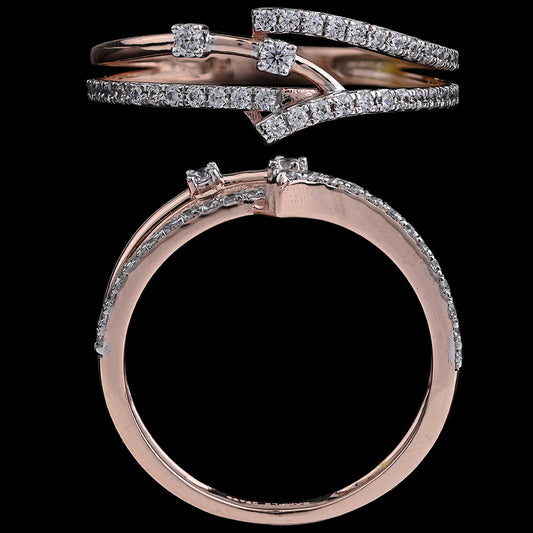 This elegant rose gold ring features a crisscross design adorned with sparkling diamonds, adding a touch of sophistication and charm. A stunning statement piece from jnjbymadhuri.
