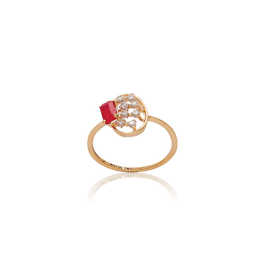 Delicate gold ring featuring a prominent red gemstone on one side and a cluster of small diamonds arranged in a circular design on the other, displayed on a white background with a subtle reflection.
