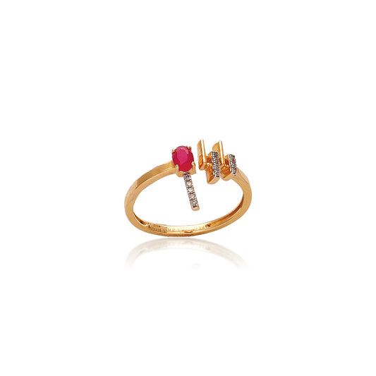 This elegant ring by jnjbymadhuri showcases a brilliant red gemstone paired with delicate diamond accents, all set in a warm gold band—blending modern flair with timeless grace.
