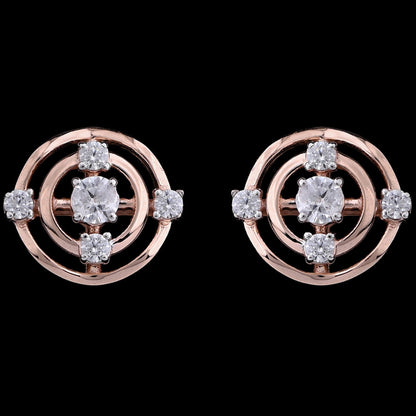 "Pair of rose gold circular stud earrings with concentric circle design, each featuring a central round diamond surrounded by smaller diamonds symmetrically spaced on the outer rings, displayed against a black background."
