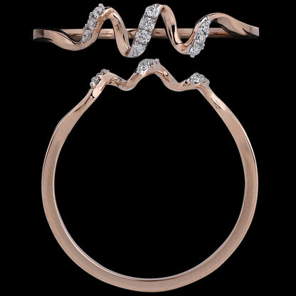 A wavy rose gold ring with scattered diamonds, creating a rhythmic, contemporary silhouette. An artistic and modern design by jnjbymadhuri.
