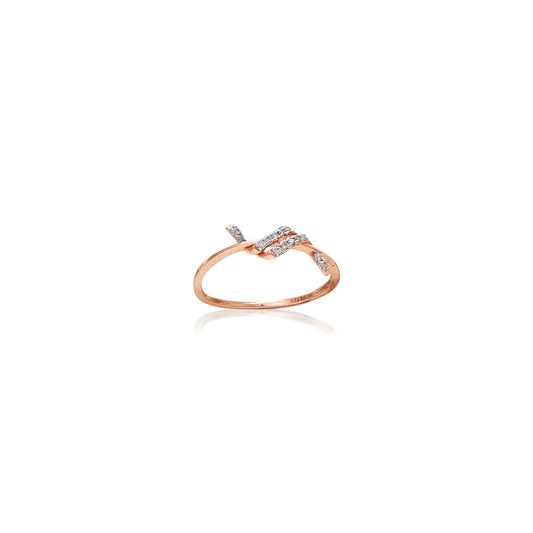 Delicate rose gold ring with a minimalist twist design, accented by a subtle cluster of diamonds for refined charm. A graceful everyday accessory by jnjbymadhuri.
