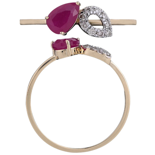 Elegant gold ring featuring a pear-shaped ruby gemstone and a diamond-studded leaf design, by jnjbymadhuri, displayed on a white background.
