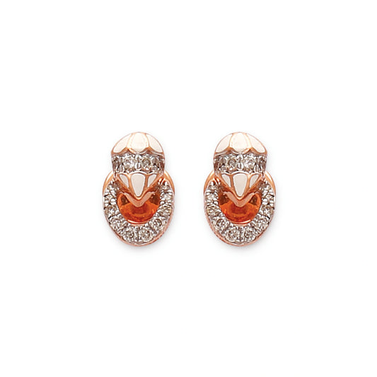 These elegant rose gold earrings from jnjbymadhuri feature a unique layered loop design encrusted with sparkling stones, blending sophistication and charm for a timeless statement accessory.
