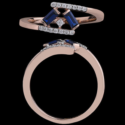Elegant rose gold ring with a geometric design, featuring deep blue baguette stones and sparkling diamonds. A bold and refined creation by jnjbymadhuri.
