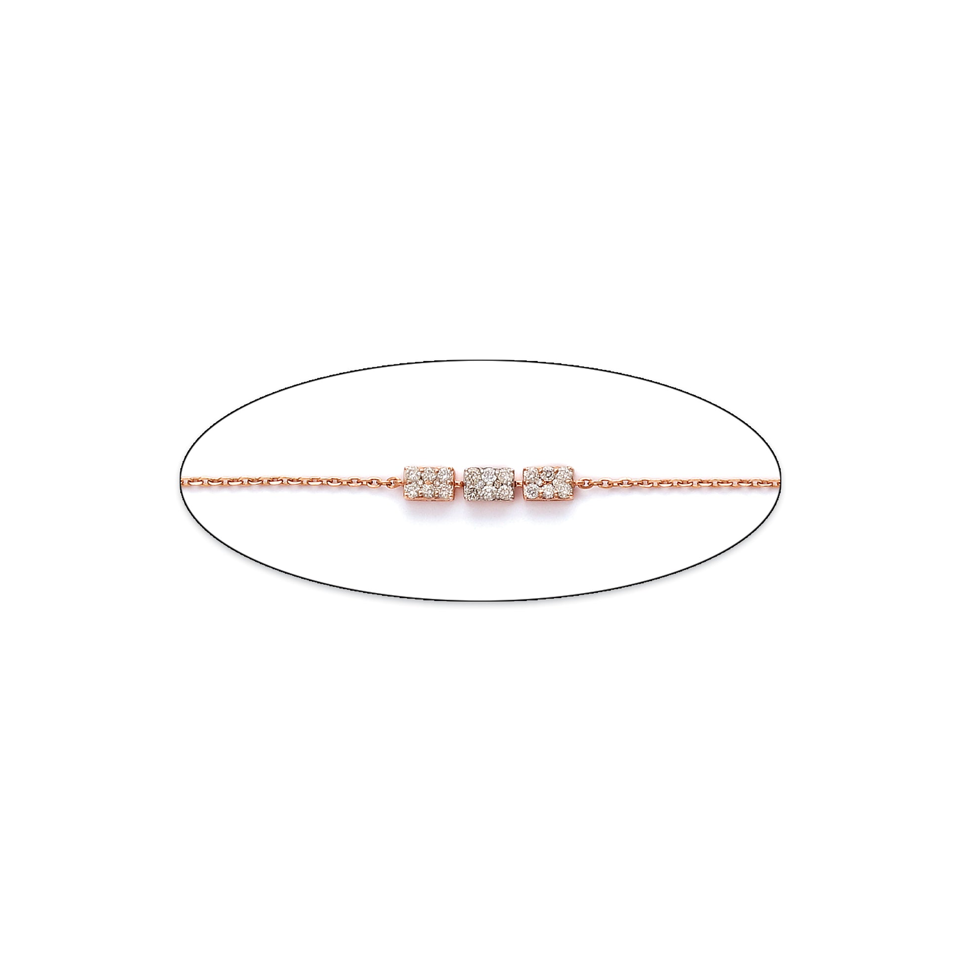 Minimalist bracelet from jnjbymadhuri featuring three sparkling cubic charms on a delicate rose gold chain, displayed on a white background.
