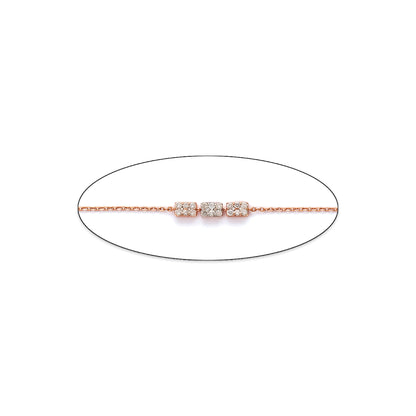 Minimalist bracelet from jnjbymadhuri featuring three sparkling cubic charms on a delicate rose gold chain, displayed on a white background.
