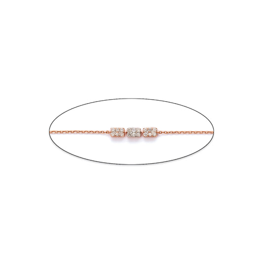 Minimalist bracelet from jnjbymadhuri featuring three sparkling cubic charms on a delicate rose gold chain, displayed on a white background.
