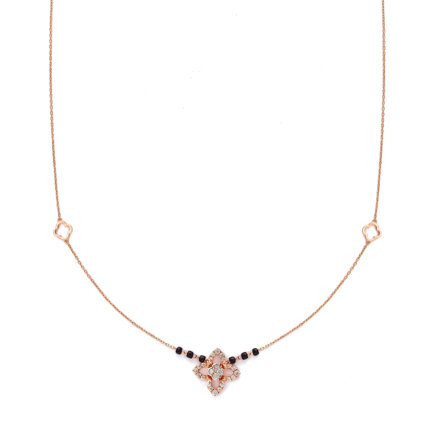 "Elegant rose gold mangalsutra necklace by jnjbymadhuri, featuring a floral pendant design with black beads on a delicate chain, displayed on a white background."
