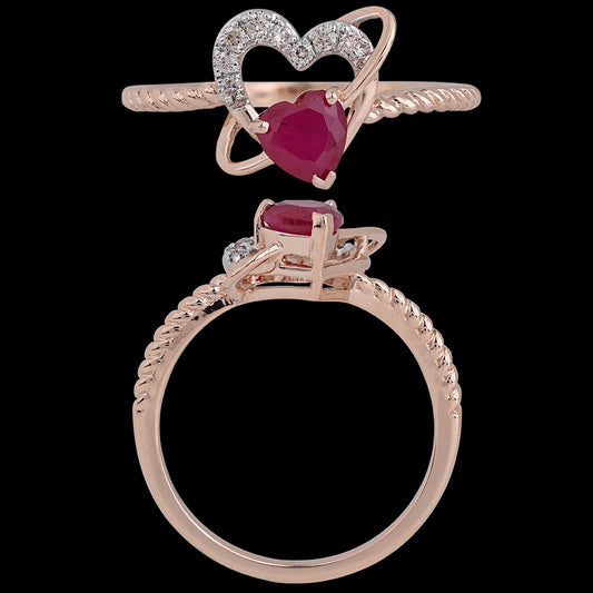 A rose gold ring featuring a heart-shaped red gemstone framed by a diamond-studded heart design. This romantic and elegant piece is a signature creation by jnjbymadhuri.