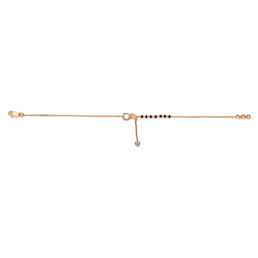 Sleek rose gold mangalsutra chain adorned with a linear arrangement of black beads and a secure clasp. A timeless and minimalistic piece handcrafted by jnjbymadhuri.
