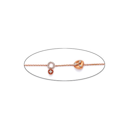 Minimalist and elegant bracelet by jnjbymadhuri, featuring a delicate chain adorned with circular and leaf-like charms in rose and white gold tones, perfect for a subtle yet sophisticated look.
