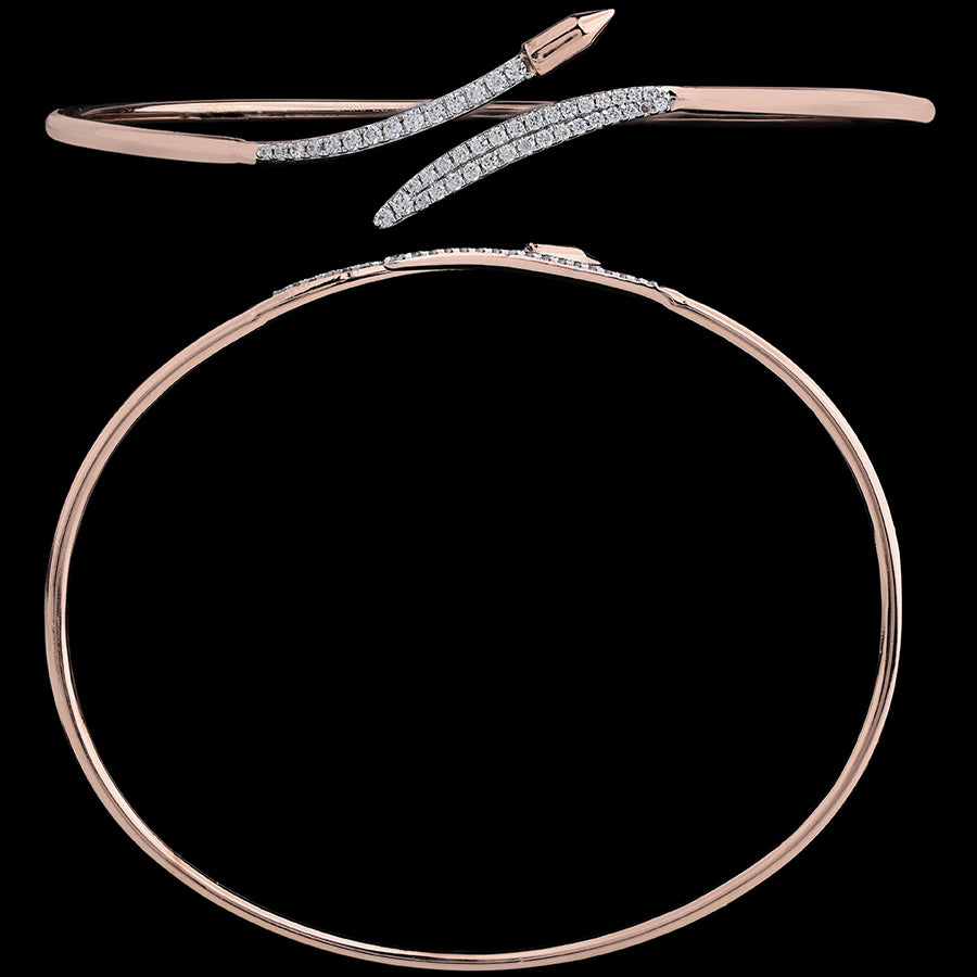 Stylish rose gold bangle with a sleek, crisscross diamond-studded motif for a modern touch by jnjbymadhuri.
