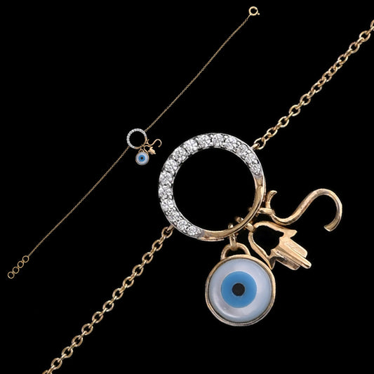 Stylish gold bracelet featuring a diamond-studded circular charm with dangling evil eye, Om, and trident symbols for protection and spirituality. A meaningful designer piece by jnjbymadhuri.
