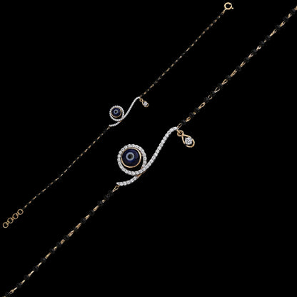 Elegant mangalsutra bracelet featuring a shimmering evil eye motif with delicate black beads, perfect for daily wear. A chic fusion of style and tradition by jnjbymadhuri.
