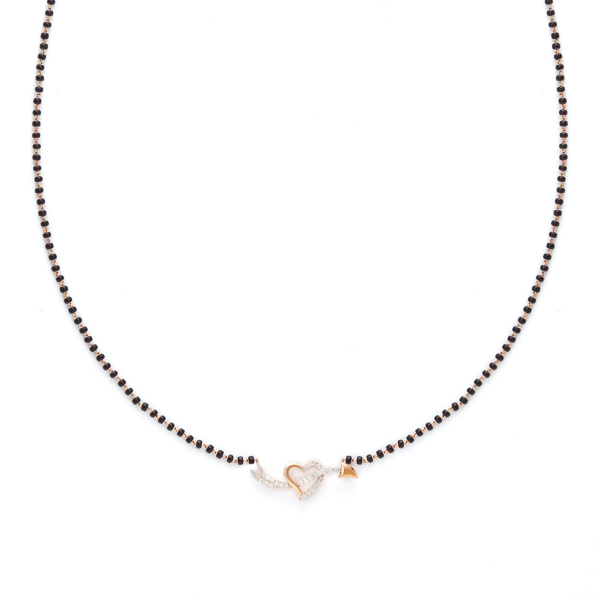 Delicate heart-shaped diamond mangalsutra pendant with classic black beaded chain, symbolizing timeless love. Crafted with elegance and grace by jnjbymadhuri.
