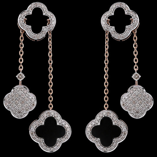 Timeless and luxurious, these clover-shaped drop earrings sparkle with intricate detailing and elegant charm—a refined creation by jnjbymadhuri.
