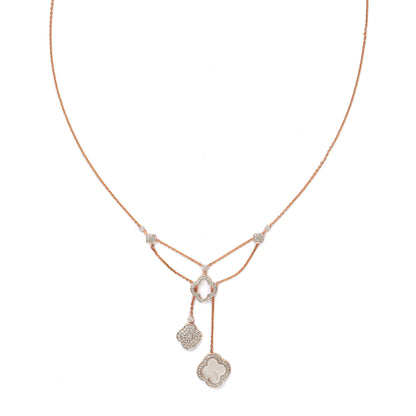 Delicate rose gold necklace featuring a dual-drop pendant design with diamond-studded geometric charms, created by jnjbymadhuri, displayed on a white background.
