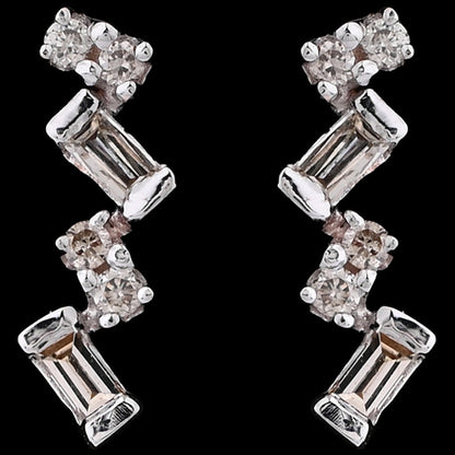 These elongated zig-zag earrings from jnjbymadhuri bring a contemporary edge with their alternating baguette and round-cut stones, creating a radiant and stylish shimmer that elevates both casual and formal looks.
