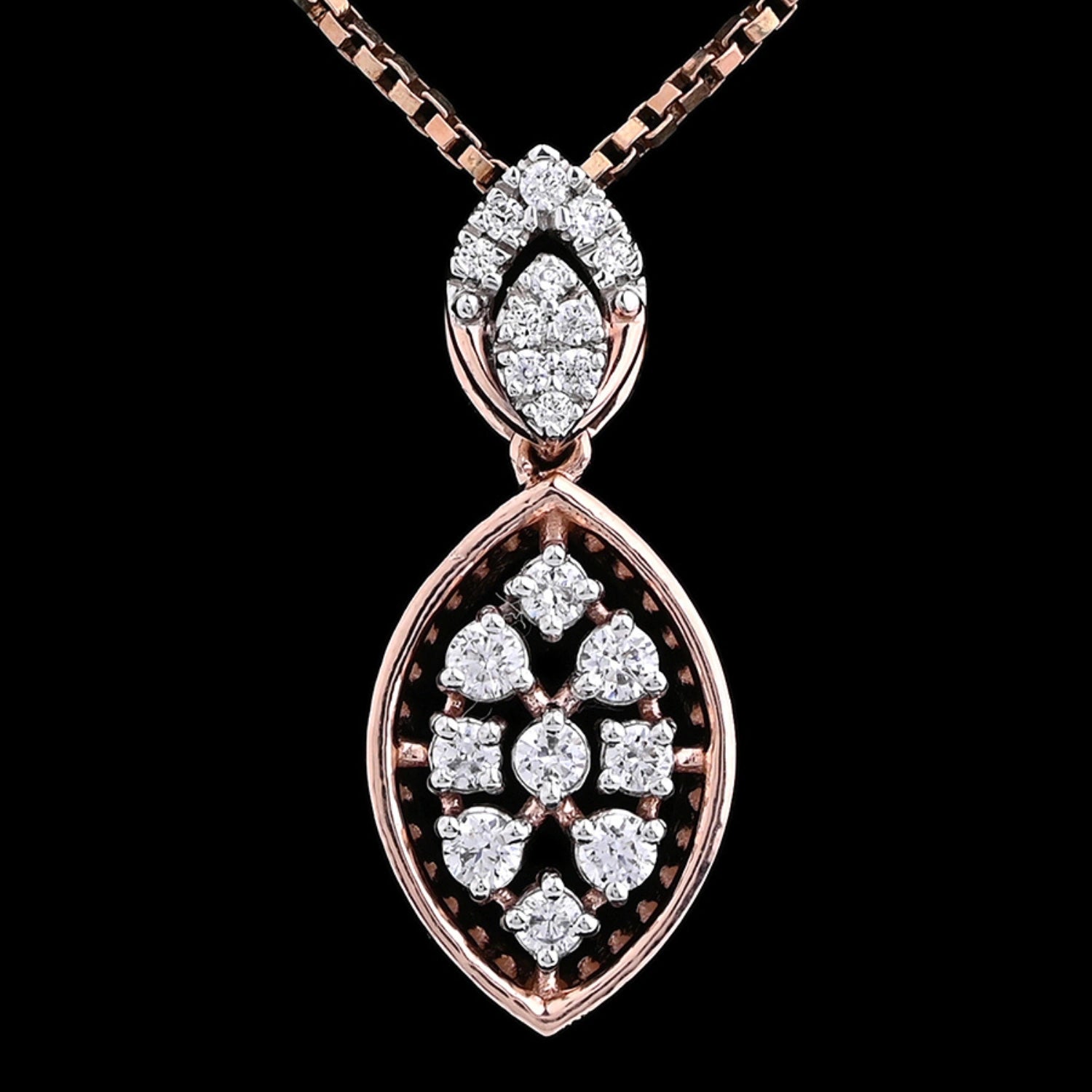 Close-up image of a rose gold pendant necklace with a marquise-shaped design featuring multiple round and baguette diamonds, suspended on a rose gold chain against a black background.
