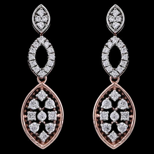 "Rose gold and white stone drop earrings by jnjbymadhuri, featuring a triple marquise-shaped design with intricate floral stonework, displayed against a black background."
