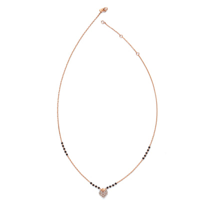 Contemporary mangalsutra with a sleek black and gold beaded chain, featuring a diamond-shaped pendant for a modern twist. Designed with elegance and simplicity by jnjbymadhuri.
