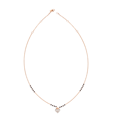 Contemporary mangalsutra with a sleek black and gold beaded chain, featuring a diamond-shaped pendant for a modern twist. Designed with elegance and simplicity by jnjbymadhuri.
