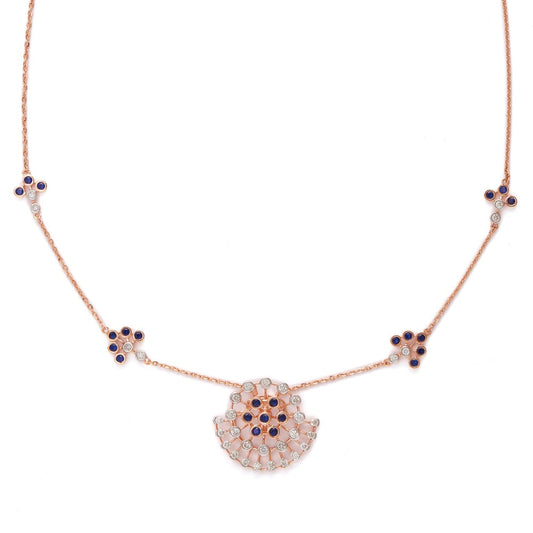 Elegant rose gold necklace featuring a central fan-shaped pendant adorned with black and white stones, complemented by matching floral accents along the chain. A signature creation by jnjbymadhuri, blending modern charm with timeless grace.
