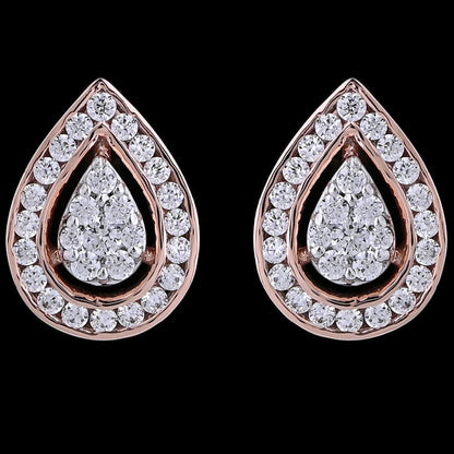 "diamond-studded teardrop earrings by jnjbymadhuri, featuring a central pear-shaped cluster surrounded by a halo of round diamonds, set in rose gold with a black background.
