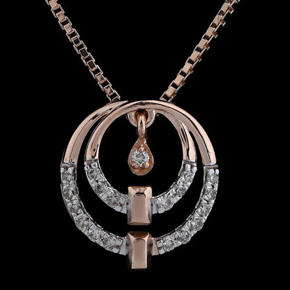 Rose gold and diamond dual-circle pendant necklace by jnjbymadhuri, featuring a teardrop detail and modern geometric elements, displayed on a dark background.
