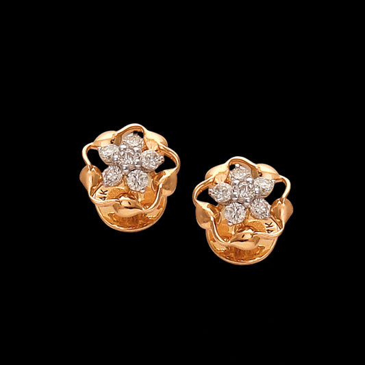 Elegant floral gold stud earrings by jnjbymaduri, designed with petal-like curves and a cluster of diamonds at the center, exuding timeless charm and refined sophistication.
