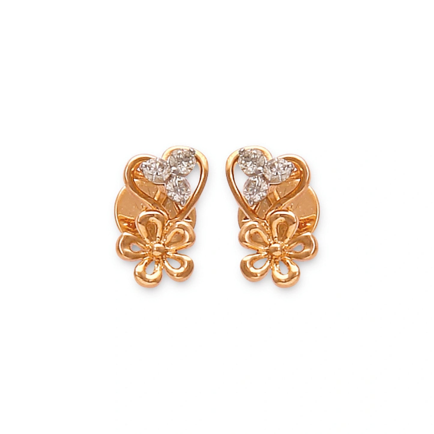 These elegant gold stud earrings by jnjbymadhuri showcase a charming heart-shaped design paired with a delicate floral motif, adorned with sparkling diamonds that add a touch of timeless grace and femininity.
