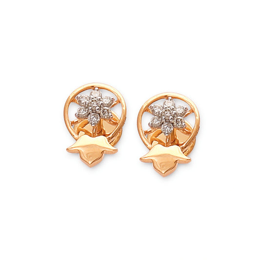 Elegant gold stud earrings by jnjbymadhuri, featuring a delicate floral motif with sparkling diamonds enclosed in a circular frame and a unique petal-like base, perfect for adding charm to any ensemble.
