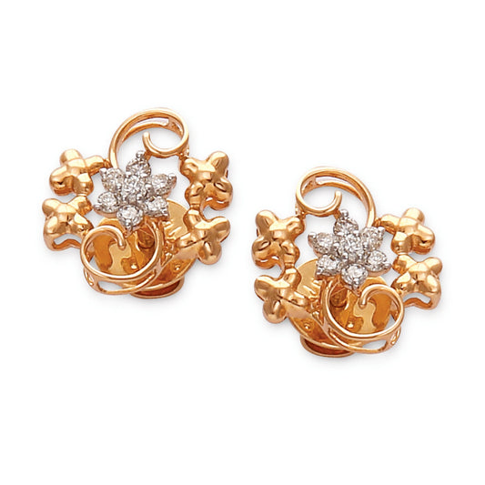 a pair of ornate rose gold earrings with intricate floral and vine designs featuring central diamond accents — jewelry by jnjbymadhuri.
