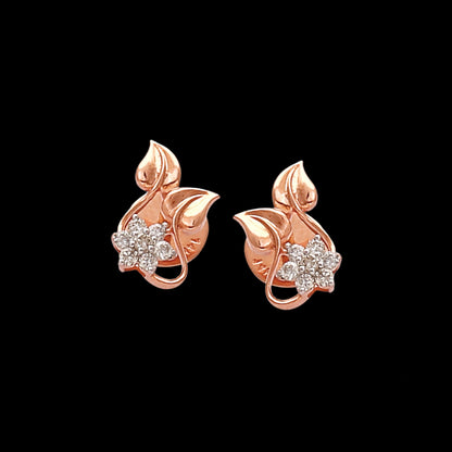 Elegant floral-inspired stud earrings by jnjbymaduri, crafted in rose gold with leaf motifs and sparkling stones, exude a delicate charm perfect for everyday sophistication.
