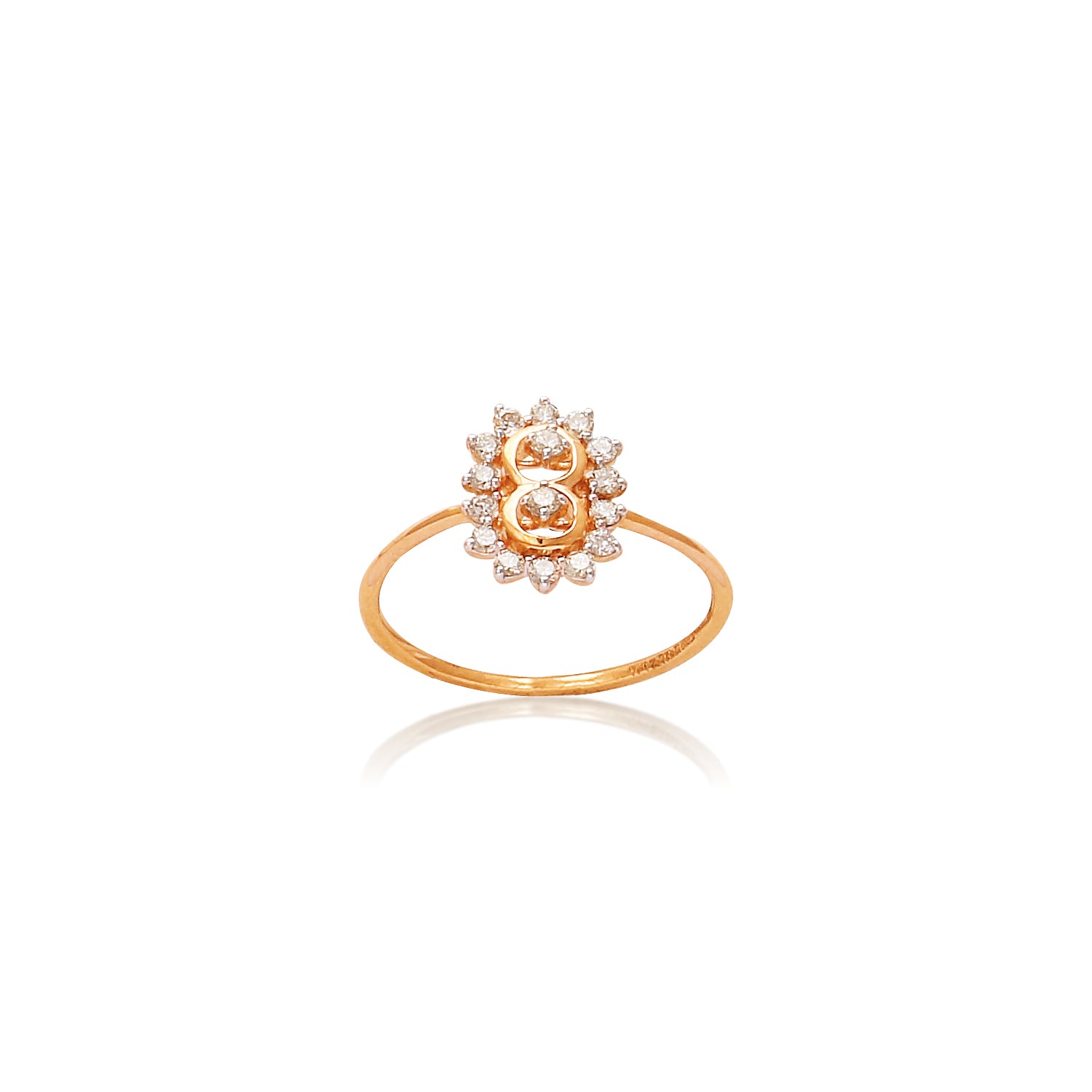 Delicate gold floral ring by jnjbymadhuri, featuring a central gemstone surrounded by a halo of shimmering diamonds in a blooming lotus design.
