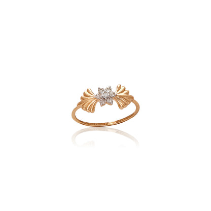 Delicate gold ring with a central star-shaped diamond cluster flanked by stylized gold leaf motifs on either side, displayed against a white background with a subtle reflection.