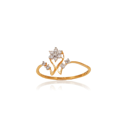 Delicate gold ring with a central star-shaped cluster of diamonds above a V-shaped band, flanked by small round diamonds on either side, set against a white background with a soft reflection.
