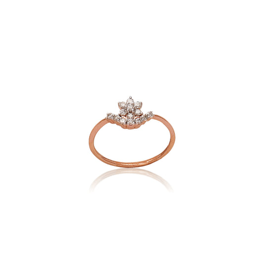 Delicate floral diamond ring by jnjbymadhuri, featuring a cluster of shimmering stones set in a rose gold band, designed for elegance and everyday charm.
