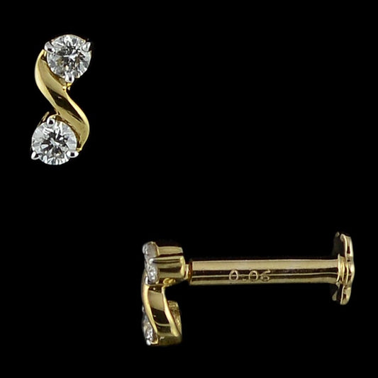 Chic gold stud earring showcasing two brilliant diamonds in an elegant S-shaped design. A graceful everyday statement from jnjbymadhuri.