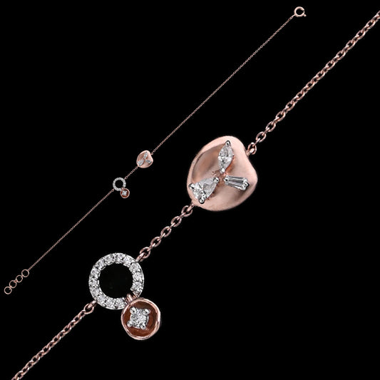 A stunning rose gold bracelet by jnjbymadhuri, showcasing a heart-shaped centerpiece with shimmering crystal accents, complemented by a circular charm and delicate chain design, perfect for adding elegance to any outfit.
