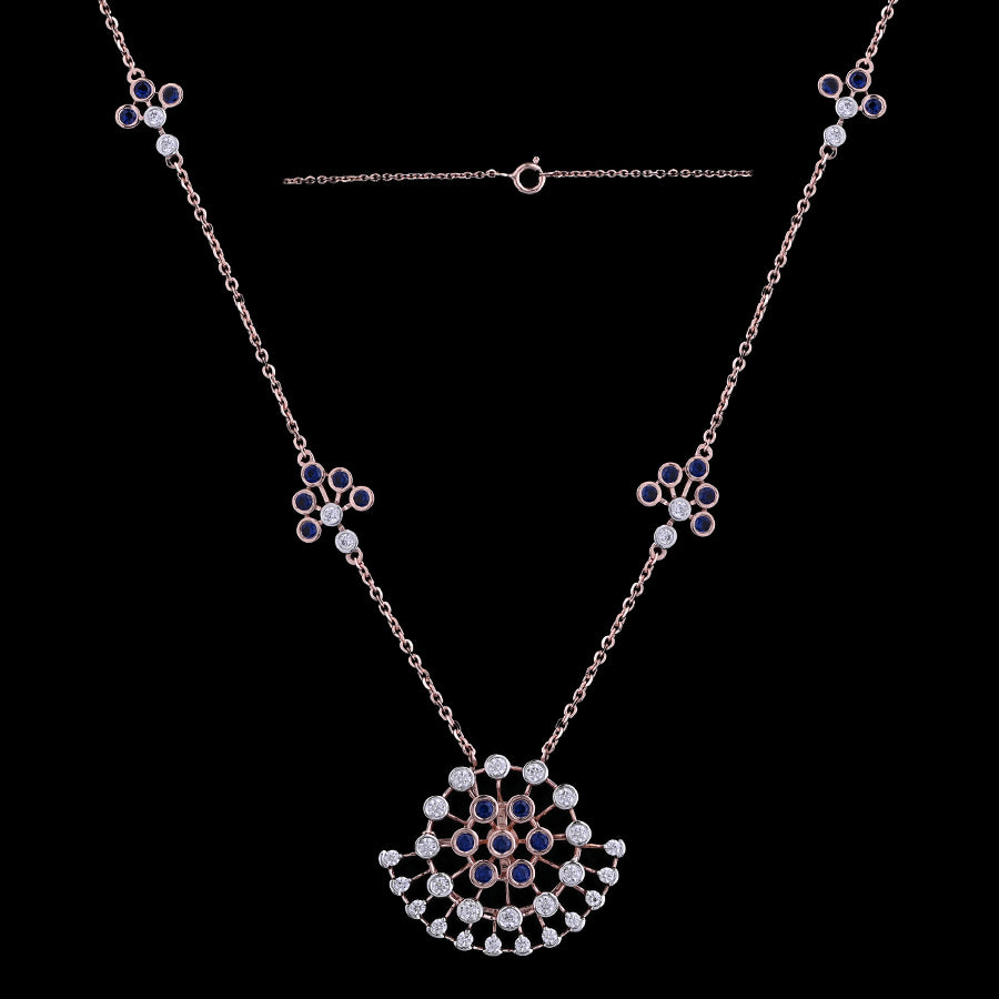 Stunning rose gold necklace with a floral fan-shaped pendant, embellished with black and white stones, and matching motif accents along the chain. A refined and artistic design by jnjbymadhuri.
