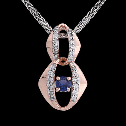 A rose gold diamond pendant with a blue center stone, suspended from a chain.