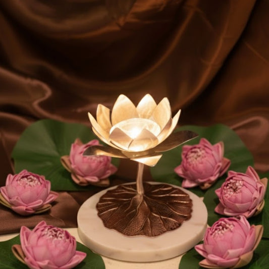 Marble Lotus Diya by JNJ by Madhuri, a beautifully crafted lotus-shaped marble diya designed for pooja, home temple, and festive rituals.