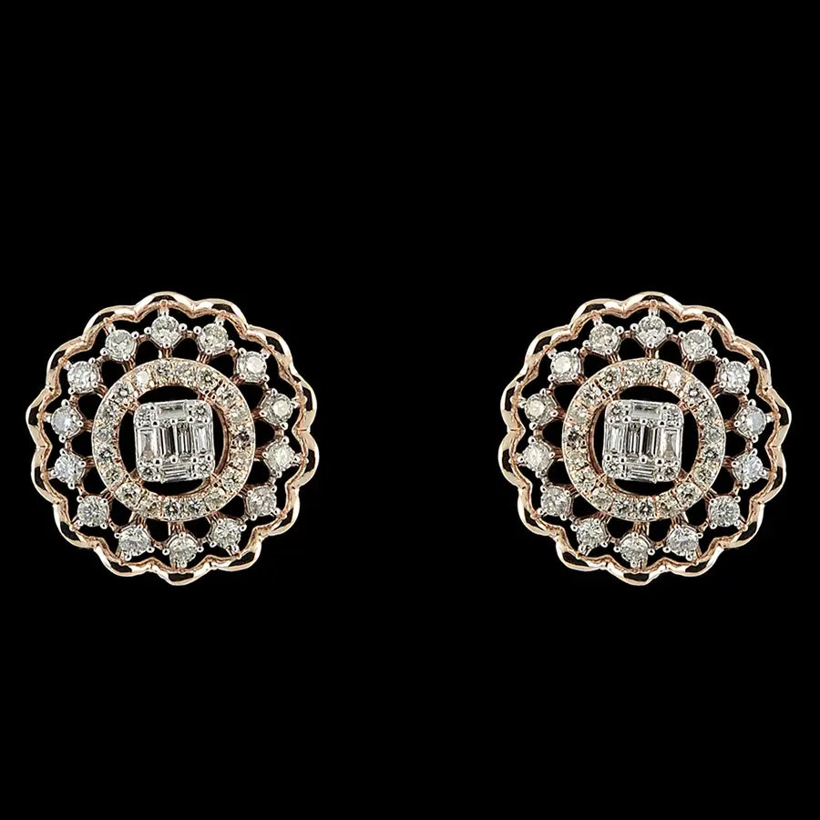 Elegant round earrings with a central baguette diamond surrounded by a scalloped diamond halo. A refined and timeless piece from jnjbymadhuri.
